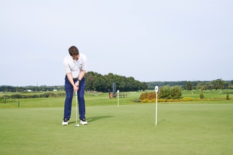 golfer practice putting on the green