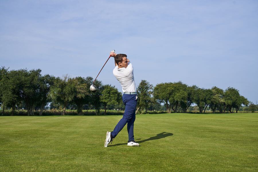 golfer release after hitting with driver