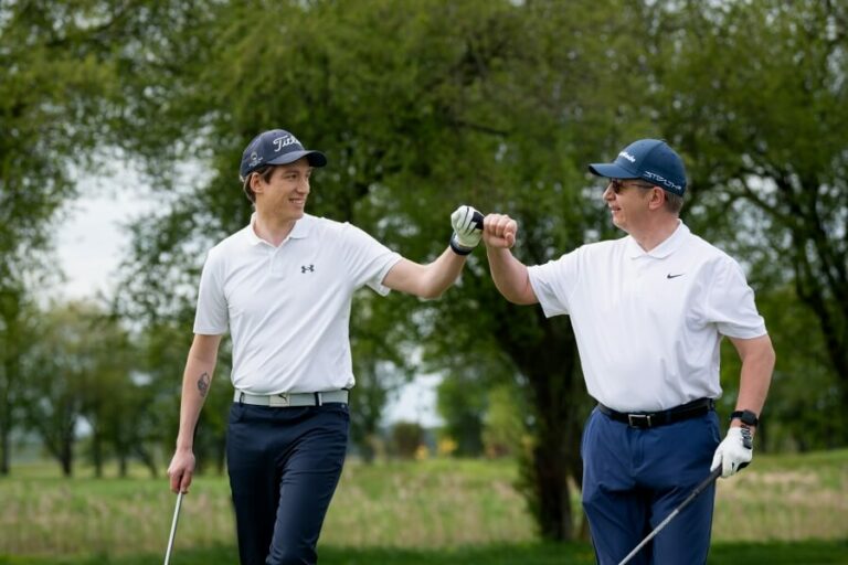 two happy golfers on the course